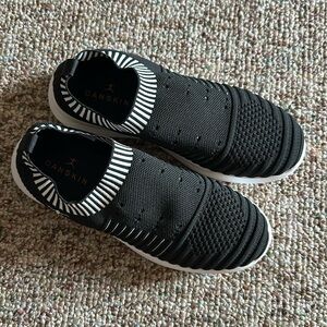 Stretchy black and white shoes. Brand new. Bought them and they are to small.